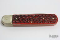 Jigged Red Bone Lever Lock Auto (#712)