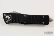 144-2 Combat Troodon T/E Partial Serrated