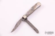82154 Tiny Trapper - Damascus and Black Lip Pearl