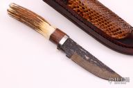 Hunter w/ Sambar Stag & Curly Maple