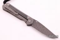 Large Sebenza 21 - Raindrop Damascus and Black Canvas Micarta