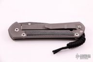 Large Sebenza 21 - Raindrop Damascus and Black Canvas Micarta