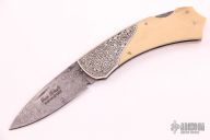 Damascus and Mammoth Engraved Lockback