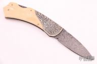 Damascus and Mammoth Engraved Lockback