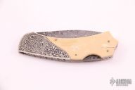 Damascus and Mammoth Engraved Lockback